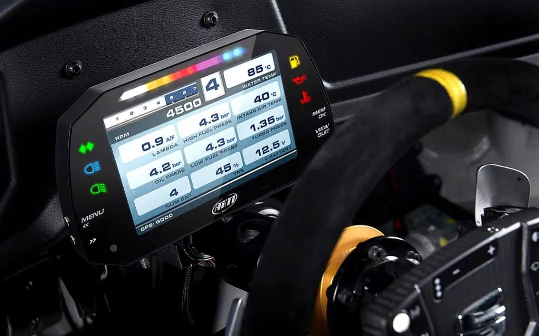 An AiM dash display installed in a race car